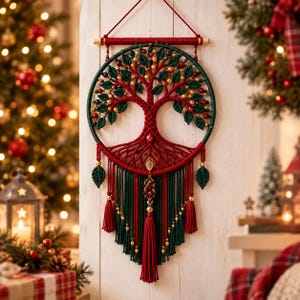 May include: A circular macrame wall hanging featuring a red and dark green tree of life design. The piece is adorned with small gold beads, red berries, and green leaf-shaped accents. Long red and green fringe hangs from the bottom with tassels.