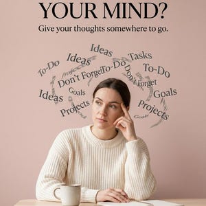 May include: A beige sweater worn by a person sitting at a wooden table with a mug and notebook. Above, text reads: TOO MUCH ON YOUR MIND? Give your thoughts somewhere to go. Floating words include Ideas, Tasks, To-Do, Don't Forget, Goals, and Projects.