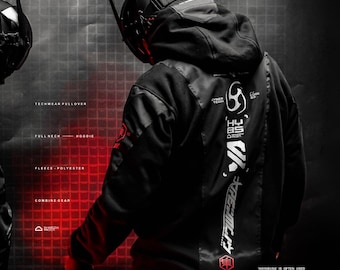 May include: A black hooded pullover featuring white graphic text and symbols on the back, including the characters HY85 and SHADOW PROCT. The garment includes a full neck design, fleece and polyester construction, and red accents on the sleeve.
