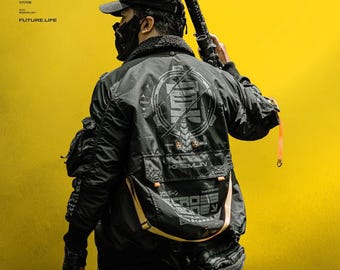 May include: A black bomber jacket featuring a large circular graphic on the back with Japanese characters, the text KREMLIN, and CROSS BONE. The jacket includes multiple utility pockets, orange strap accents, and a black cap against a yellow background.