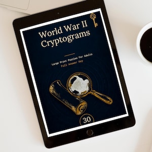 May include: A digital tablet displaying a book cover titled World War II Cryptograms, Large Print Puzzles For Adults, Full Answer Key. The cover features a gold magnifying glass, a gold key icon, and the number 30 on a dark blue background.