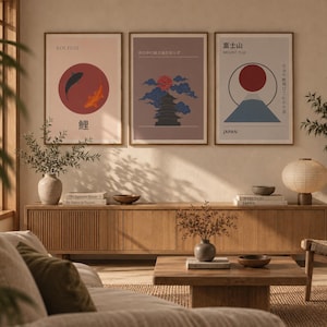 May include: Three framed wall art prints displayed in a row. The left print features koi fish in a red circle. The centre print shows a pagoda with blue clouds and a red sun. The right print depicts Mount Fuji with a red sun and Japanese text.