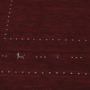 May include: A deep burgundy rug featuring a series of small, stylized blue animal figures and white dotted lines arranged in a geometric pattern. The design includes tiny green floral motifs interspersed among the animals on the dark red surface.