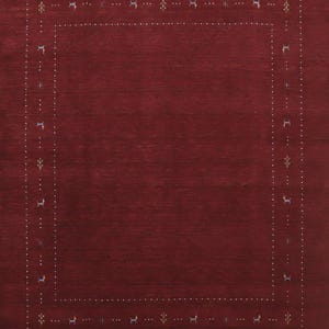 May include: A deep burgundy rectangular area rug featuring a central solid field surrounded by a decorative border. The border consists of two parallel lines of small white dots interspersed with tiny stylized animal and floral motifs.