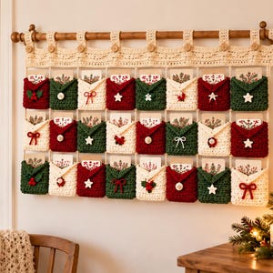 May include: A wall-hanging crochet advent calendar featuring twenty-four individual pockets in red, green, and cream. Each pocket is adorned with small buttons, bows, or holly motifs and contains a card. The calendar hangs from a wooden rod.
