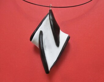 White black pointed  diamond shaped brooch pendant/ necklace or brooch/ polymere clay one side white other black/ hanging on pin or eye.