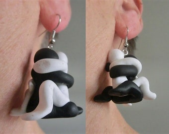 Hug close sitting couple/  dangling earrings/ black and white Fimo (polymer clay) figurines inspired on a bronze sculpture/  4.3 cm.