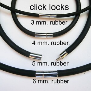 May include: Four black rubber cords with silver click locks. The cords are labeled with their diameter in millimeters: 3 mm, 4 mm, 5 mm, and 6 mm.