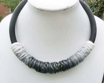 Black grey white ombre necklace/ bow shape/ gradient shaded thin polymere tubes on 4" rubber cord with lobster clasp and chain.