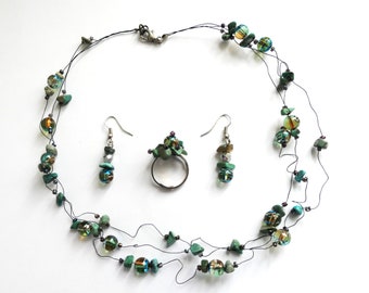 Turquoise beads necklace/  thin black iron wire/ shiny glass and turquois stone beads/ 3 strands with lobster, matching ring and earrings