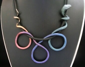 Gradient rainbow colored metallic snake necklace/ polymer clay with metal powder around a 0.24" rubber cord with lobster clasp and chain