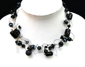 Black beads necklace/ with thin black iron wire/ different glass beads, small onyx stones/ 2 parts with lobster closure/ you can vary length