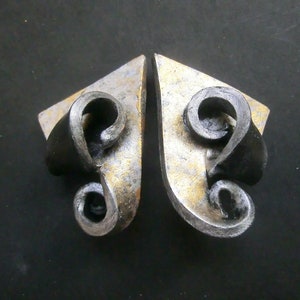 Silver-gold and black curly earrings/ steel posts or clips/ black polymer clay/ incised triangle  side pointed painted with metal paint.