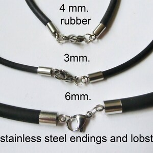 May include: Three black rubber cords with stainless steel ends and lobster clasps. The cords are labeled 4 mm, 3 mm, and 6 mm.