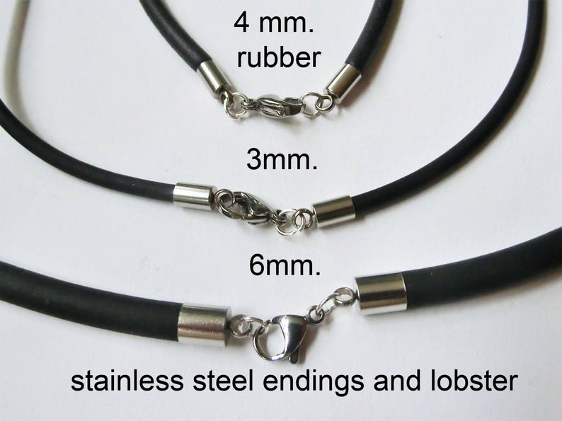 May include: Three black rubber cords with stainless steel ends and lobster clasps. The cords are labeled 4 mm, 3 mm, and 6 mm.