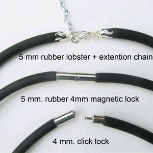 May include: Three black rubber necklace cords with different clasps. The top cord has a silver lobster clasp with an extension chain. The middle cord has a silver magnetic clasp. The bottom cord has a silver click clasp. The cords are labeled with their size and clasp type.