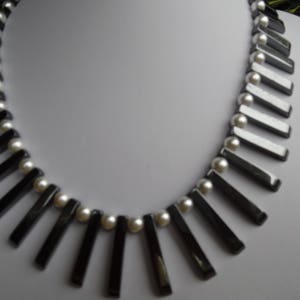 shell bead necklace with black and gold sahri thread Intertwined hematite