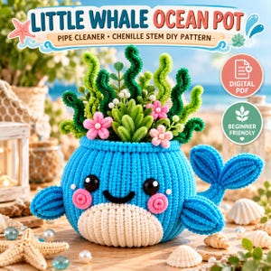 May include: A blue whale-shaped pot crafted from pipe cleaners, featuring a white belly, black eyes, and pink cheeks. The pot contains green chenille stem seaweed and pink flowers. Text reads: LITTLE WHALE OCEAN POT PIPE CLEANER CHENILLE STEM DIY PATTERN.