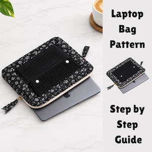 May include: A black laptop sleeve with a white floral pattern and a black ribbed exterior pocket featuring two white snap buttons. The sleeve is partially open, revealing a dark gray laptop inside. The text Laptop Bag Pattern Step by Step Guide is visible.