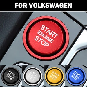 May include: A circular engine start stop button for a Volkswagen vehicle. The button features a matte finish with the text START ENGINE STOP printed in white. The image displays five color variations: red, black, silver, gold, and blue.