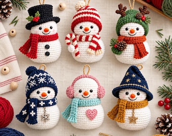 May include: Six crocheted snowman ornaments featuring various accessories including a black top hat, red and white striped hat, green reindeer hat, blue patterned hat, pink earmuffs, and a blue star-patterned hat, each with a hanging loop.