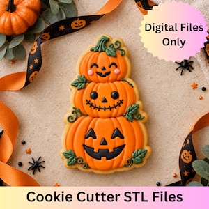 May include: A cookie shaped like a stack of three orange pumpkins with jack-o'-lantern faces, green stems, and leaves. The text Digital Files Only and Cookie Cutter STL Files is visible. The design features black icing details for the faces.