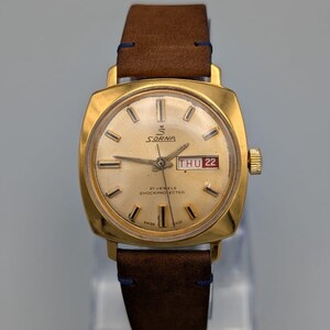 Vintage Sorna Swiss Made Watch | 1970s Gold Tone Cushion Case, Day Date (21 Jewels)