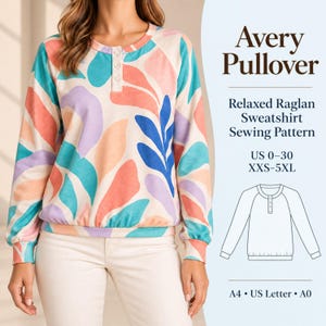 May include: A long-sleeve pullover sweatshirt featuring a multi-coloured abstract leaf pattern in shades of coral, teal, and lavender on a cream background. The garment has a three-button placket, raglan sleeves, and a banded hem. Text reads Avery Pullover.