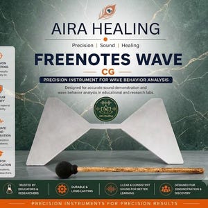 May include: A silver-coloured metal Freenotes Wave CG instrument with a butterfly-like shape, accompanied by a wooden mallet with a black felt head. The text AIRA HEALING and FREENOTES WAVE CG is displayed above the instrument on a dark green background.