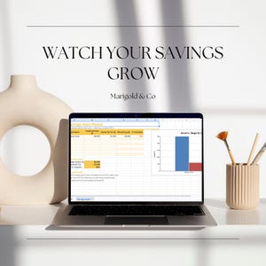 May include: A laptop displaying a savings goals planner spreadsheet with a bar chart, positioned between a beige ceramic vase with a circular cutout and a ribbed cylindrical pen holder containing three pens, under the text WATCH YOUR SAVINGS GROW.
