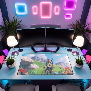 May include: A rectangular desk mat featuring a printed landscape illustration of a character with a shield standing in a grassy field with mountains, placed on a light blue desk with two computer monitors, two lamps, and two potted plants.
