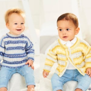 May include: Two babies in knitted garments. One wears a blue and white striped jumper with blue jeans. The other wears a yellow and white striped cardigan with blue jeans. Both are smiling. The jumpers and cardigans are likely made of wool.