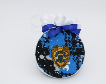 Police Officer Ornament with a gold badge