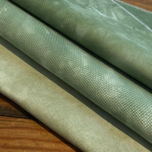 Cross stitch Hand dyed Aida in 14, 16 and 18 counts. And 32 count Murano. Forest greens.