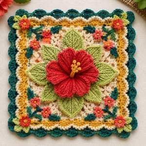 May include: A square crochet doily featuring a large, three-dimensional red hibiscus flower with a yellow stamen at the center, surrounded by green leaves. The background is cream-colored lace, framed by yellow and dark teal scalloped borders.