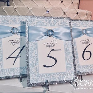 Table Numbers in Light Blue-Silver with Ribbon, Bling, Glitter - for Wedding Reception Tables, Party Decorations, Party Signs, Winter Theme