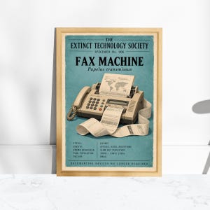 May include: A framed poster featuring a beige fax machine on a teal background. The text reads THE EXTINCT TECHNOLOGY SOCIETY, SPECIMEN No. 006, FAX MACHINE, and Papelus transmissus, with details on status, habitat, and peak population.