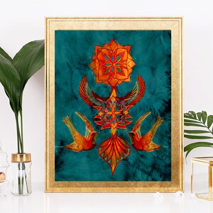 May include: A framed print with a teal background featuring a symmetrical design of orange and red geometric shapes and two stylised birds. The design is reminiscent of a mandala.