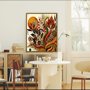May include: A framed abstract art print featuring a vibrant botanical design. The artwork showcases a warm color palette with orange, red, and green hues. The composition includes stylized flowers, leaves, and a sun-like element.