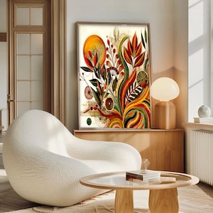 May include: A framed abstract art print featuring a vibrant botanical design. The artwork showcases a mix of red, orange, yellow, and green hues, with a large orange circle and various plant-like shapes. The print is displayed above a wooden cabinet.