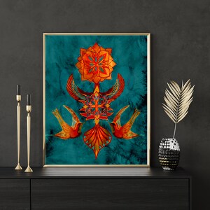 May include: A framed print with a teal background featuring a symmetrical design of stylised birds and geometric shapes in shades of orange, red, and gold.