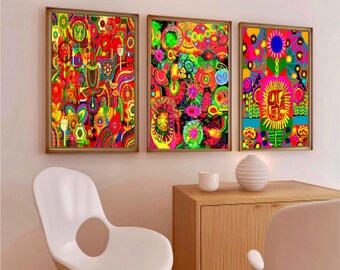 May include: Three framed abstract art prints with vibrant colors. The artwork features a variety of shapes and patterns in shades of red, yellow, green, and blue. The frames are a warm brown color, and the art is displayed on a light-colored wall.