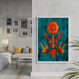 May include: A teal blue framed print with a geometric design in orange and gold. The design features a stylised flower with birds on either side.