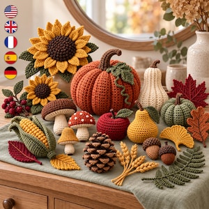 May include: A collection of crocheted autumn-themed items including a large orange pumpkin, sunflowers, mushrooms, a red apple, a yellow pear, a pinecone, wheat stalks, acorns, a corn cob, and various colorful fabric leaves.