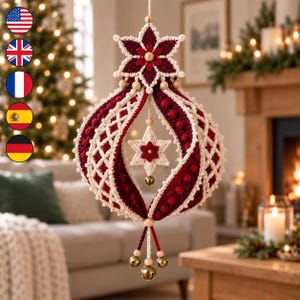 May include: A decorative hanging ornament crafted from crocheted yarn in deep burgundy and cream colors. The structure features a large star at the top, a central lattice-patterned bulbous shape, a small inner star, and three small brass-colored bells.
