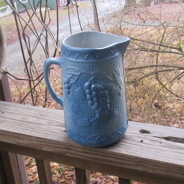 BLUE STONEWARE PITCHER with grapes and leaves