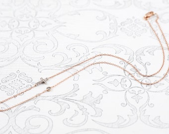 Collar de cruz de diamantes de oro rosa de 14 quilates con diamante extra