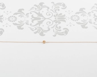 Pulsera de botón de oro amarillo de 14 quilates