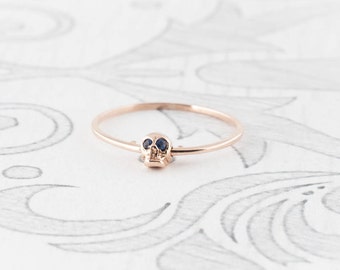 14K Rose Gold Moving Skull Ring with Sapphire Eyes