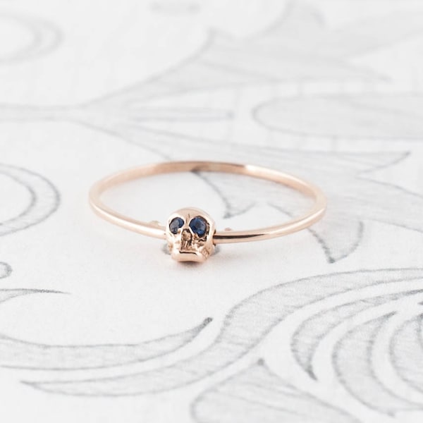 14K Rose Gold Moving Skull Ring with Sapphire Eyes